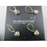 Two pairs of nine carat gold heart shaped earrings in the Celtic style, each with two tiny diamonds,