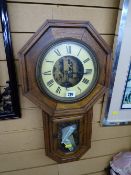 Octagonal framed wooden American pendulum wall clock with purchase receipt 1970s