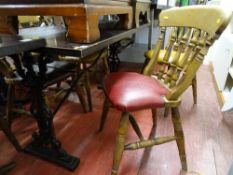 Hardwood table with metal supports and five spindlebacked chairs