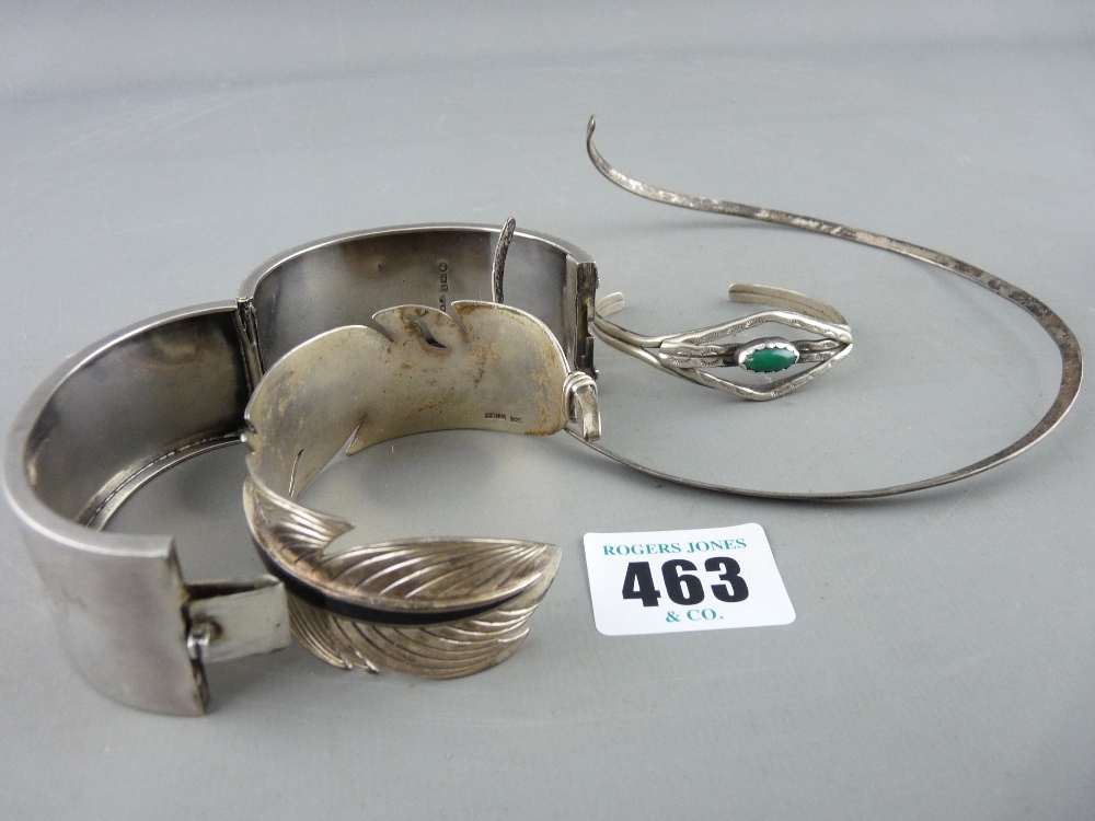 Three silver bracelet bangles and a neck band