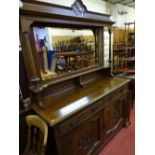 Polished wood mirror backed sideboard with carved base cupboard doors