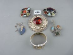 Four Scottish stone set brooches, a silver and lapis pendant and a Trafiri bangle, three brooches