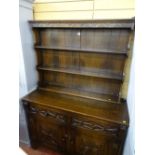 Reproduction oak dresser with carved detail