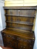Reproduction oak dresser with carved detail