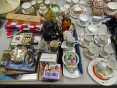 Large parcel of mixed items - teaware, promotional CDs, two instant cameras, prints, coasters and