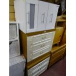 Pair of matching three drawer bedroom chests and a white three drawer bedside chest