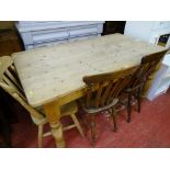 Pine farmhouse table, antique style with end drawer along with three farmhouse style chairs