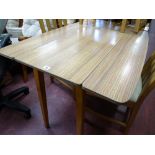 Wood effect melamine table with twin drop flap sides