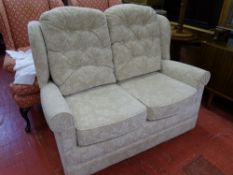 Light floral upholstered two seater couch