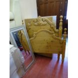 Antique style carved pine single bed frame and a modern framed wall mirror