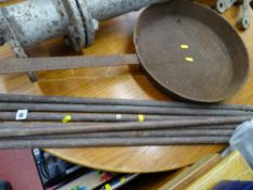 Parcel of vintage brass stair rods and a large cast frying pan