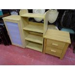Three modern light wood items of storage furniture