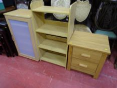 Three modern light wood items of storage furniture
