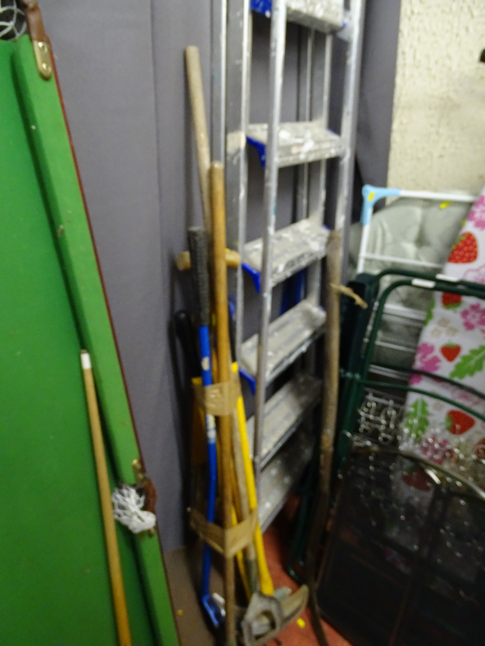 Metal six tread stepladder, a parcel of long handled garden tools and a lump hammer etc