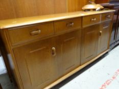 A modern lightwood sideboard with concertina doors