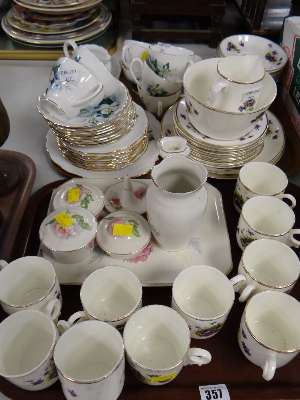 Two trays of various patterned teaware