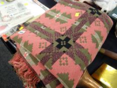 A pink & green geometric patterned Welsh woollen blanket
