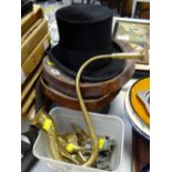A vintage top hat in a leather box together with a brass ear trumpet