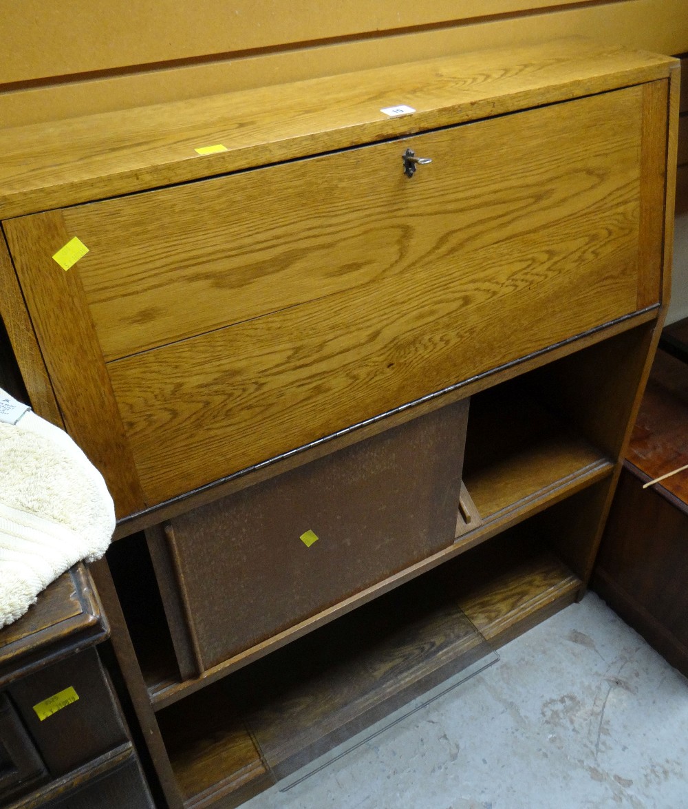 A vintage lightwood bureau bookcase