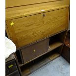 A vintage lightwood bureau bookcase