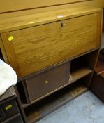 A vintage lightwood bureau bookcase