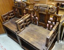 A pair of carved Oriental hardwood armchairs, a pair of wheel back chairs (distressed) & three