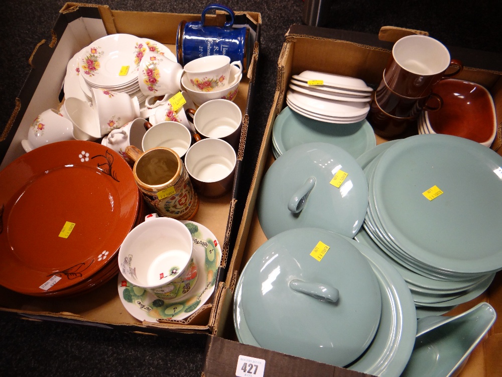 Two crates of pottery dinnerware in various patterns & novelty mugs & cups etc