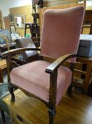 A vintage armchair in buttoned pink upholstery