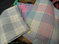 A selection of vintage check patterned woollen blankets