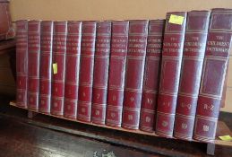 Thirteen volumes of The Children's Dictionary / Encyclopedia on stand