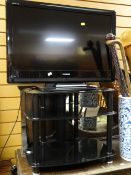 A Toshiba 32-inch flatscreen TV & modern stand E/T