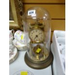 A vintage brass effect dome mantel clock
