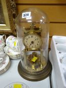 A vintage brass effect dome mantel clock