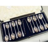 A cased set of twelve hallmarked silver teaspoons together with sugar nips, 6.6 ounces approx.