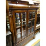 A reproduction continental-style china cabinet