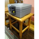 A modern heavy duty portable Century Safe secure box & a square topped table