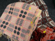 Two geometric patterned Welsh woollen blankets (pink & red)