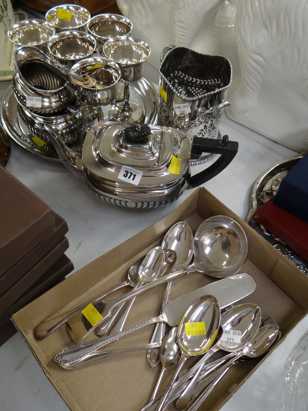 A three-piece EPNS teaset, EPNS bottle stand, tray & loose cutlery etc