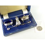 A cased hallmarked silver cruet set together with a Queen Mother's 90th birthday £5 crown