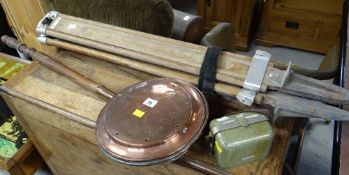 A copper bed warming pan, a Kern vintage tripod & Kern level