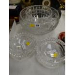 A modern Waterford crystal bowl, two Waterford crystal ashtrays & a large cut glass bowl