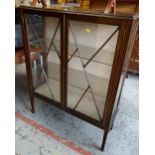 A vintage two-door china cabinet