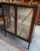 A vintage two-door china cabinet