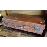 A good cowhide covered vintage suitcase by Flaxite