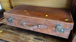 A good cowhide covered vintage suitcase by Flaxite