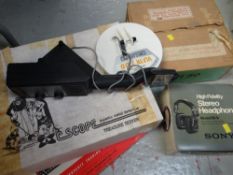 A boxed Treasure Seeker metal detector together with boxed headphones, vintage Monopoly etc