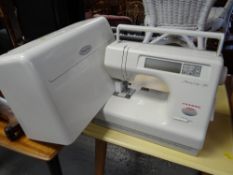 A modern electric Memory Craft 5700 sewing machine by Janome E/T