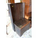 An unusual antique box seat settle