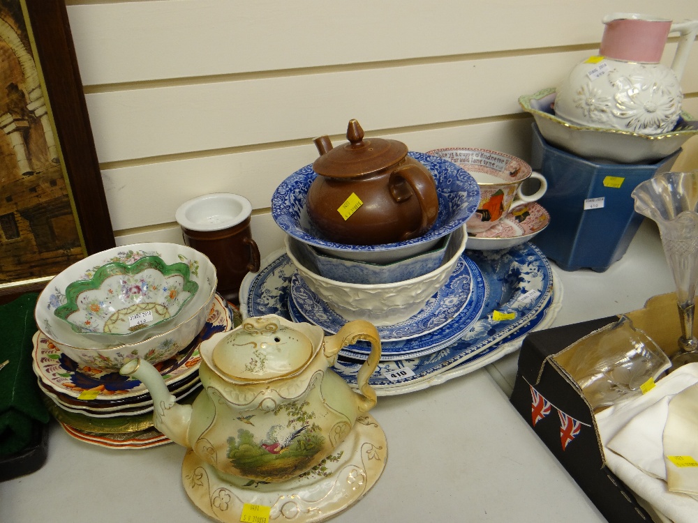 A parcel of pottery including blue & white meat platters, a novelty large breakfast cup & saucer,