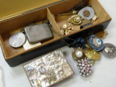 Vintage cigarette box containing small items of silver, small costume jewellery, mother-of-pearl